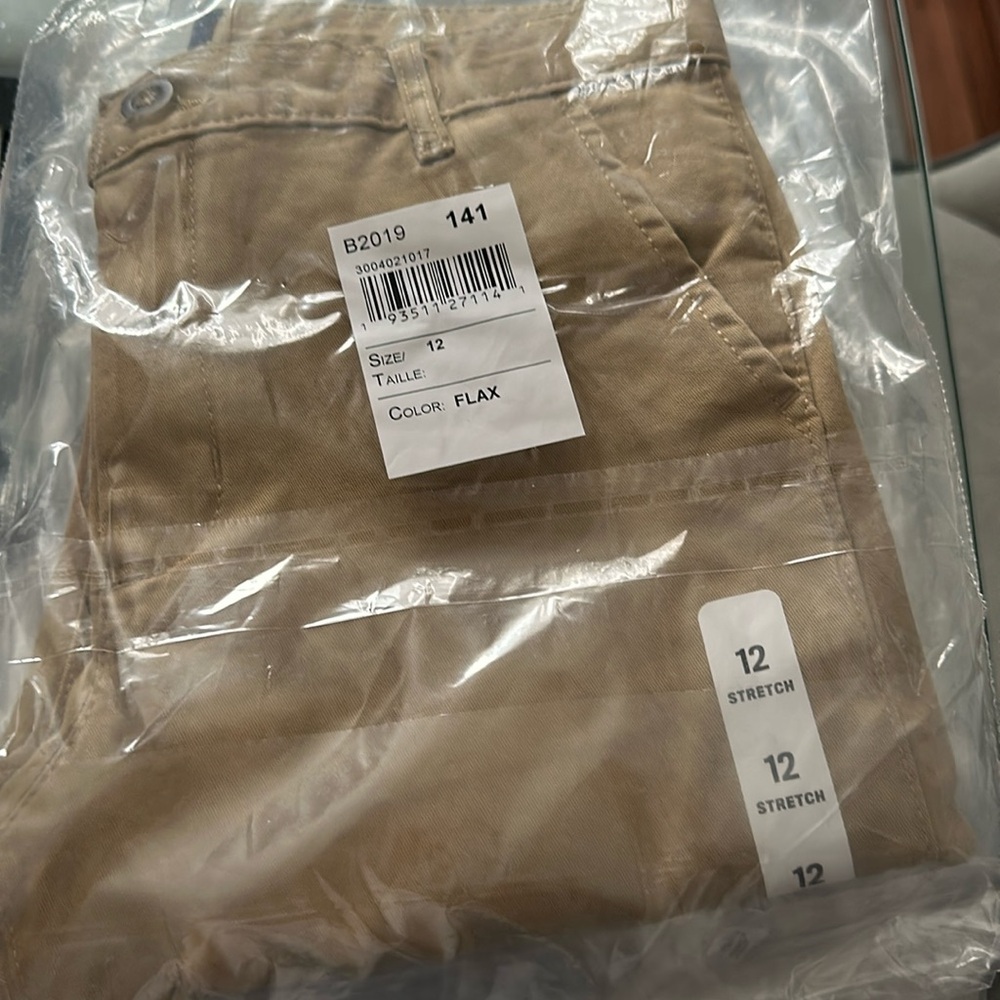 Three Uniform pants. Two khakis one nvy blue